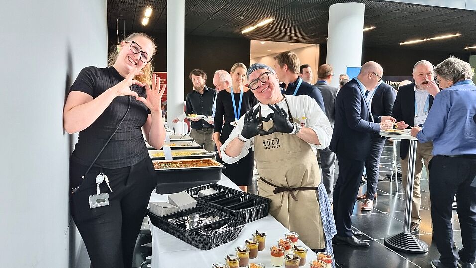 Catering Crew showing heart signs with their hands during lunch break at The Automotive Battery – Key Technology for Electric Vehicles 9th - 10th July 2025