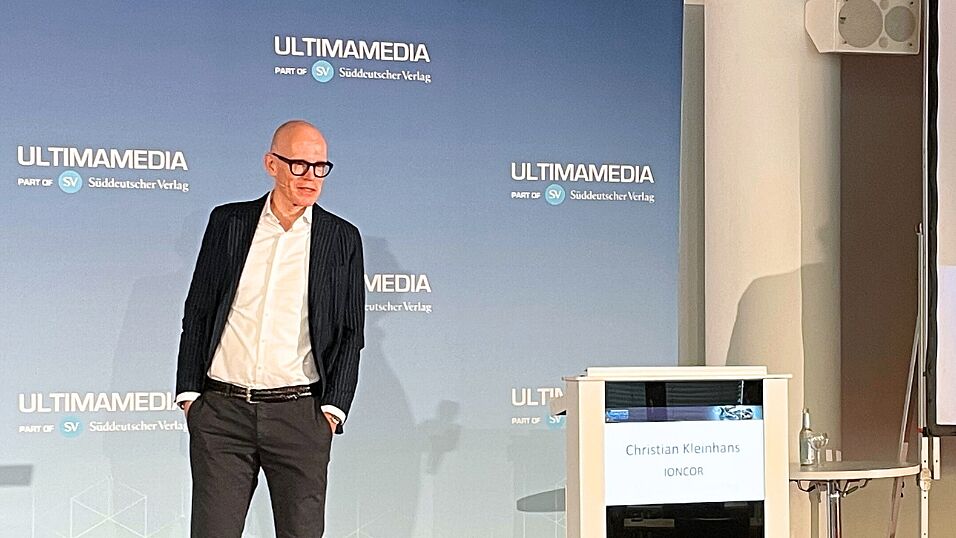 Close-up of Christian Kleinhans on stage with his keynote Heavy-duty Electrification: Challenges and key Battery Trends at The Automotive Battery – Key Technology for Electric Vehicles 9th - 10th July 2025