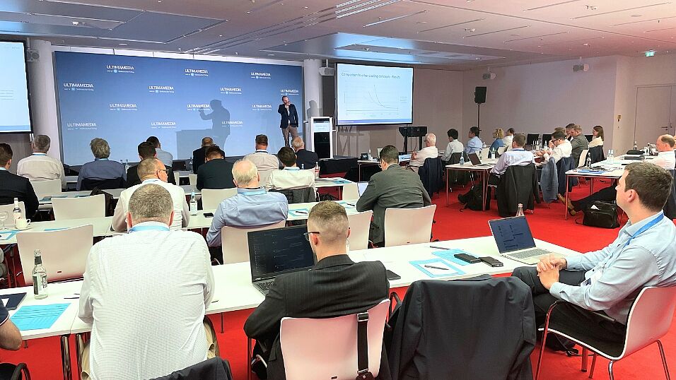 Attendees looking at Maximilian Schirp during his presentation Potential of a novel multifunctional structural battery cooling technology at The Automotive Battery – Key Technology for Electric Vehicles 9th - 10th July 2025
